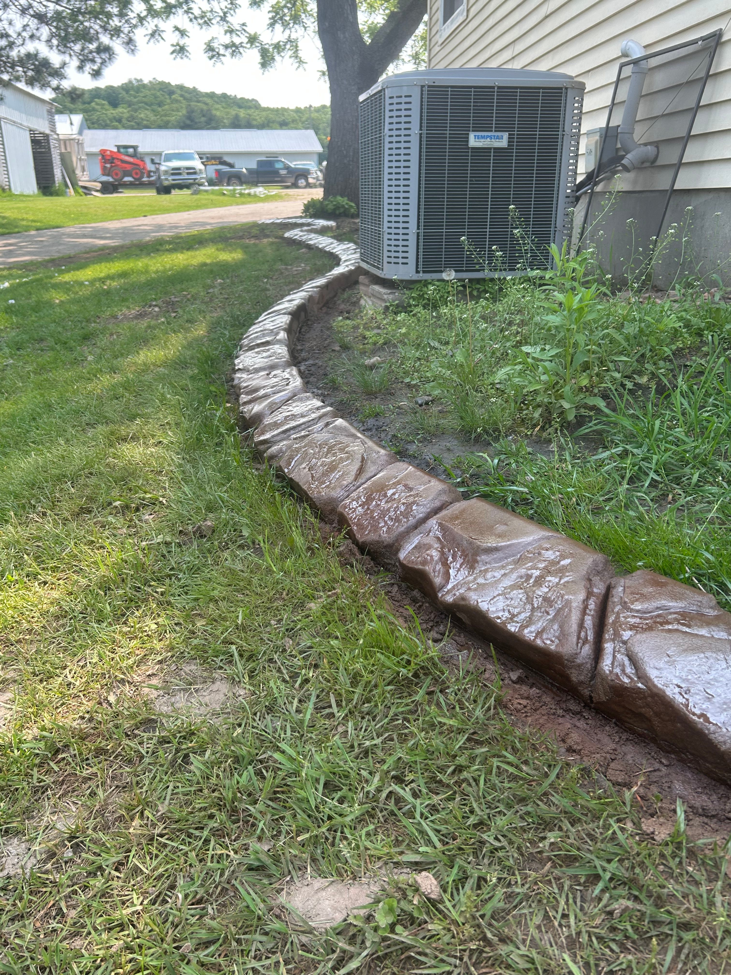 Brown decorative curbing in yard