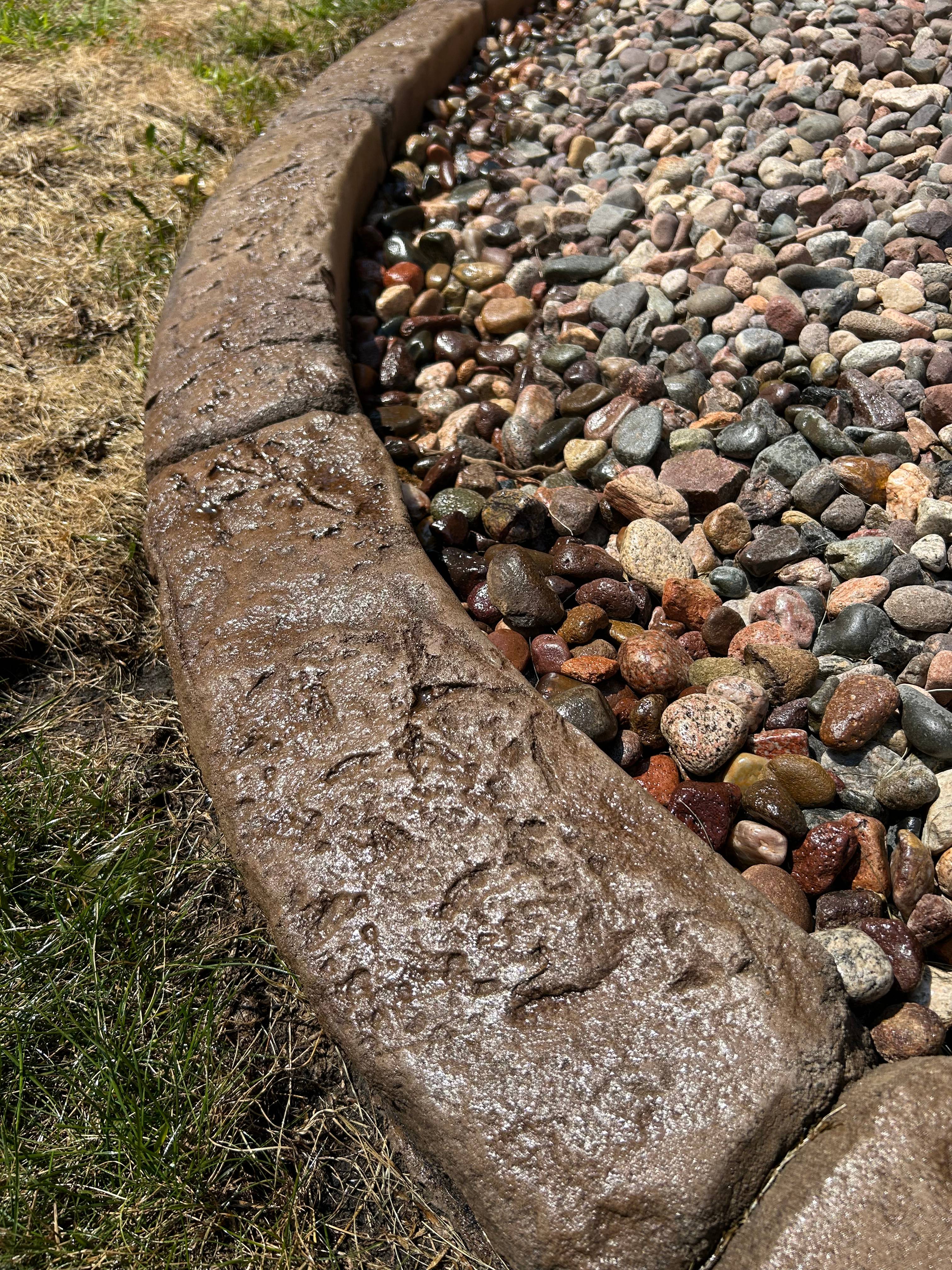 Rock and mulch installation with curbing border